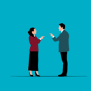 A man and woman pointing fingers at each other